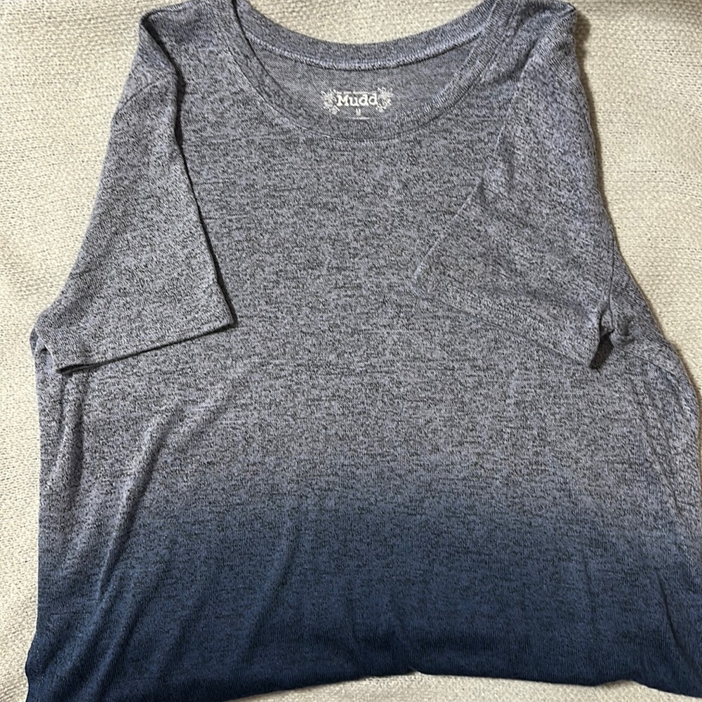 Tri-colored shirt, dressier than a t-shirt but the material very similar.